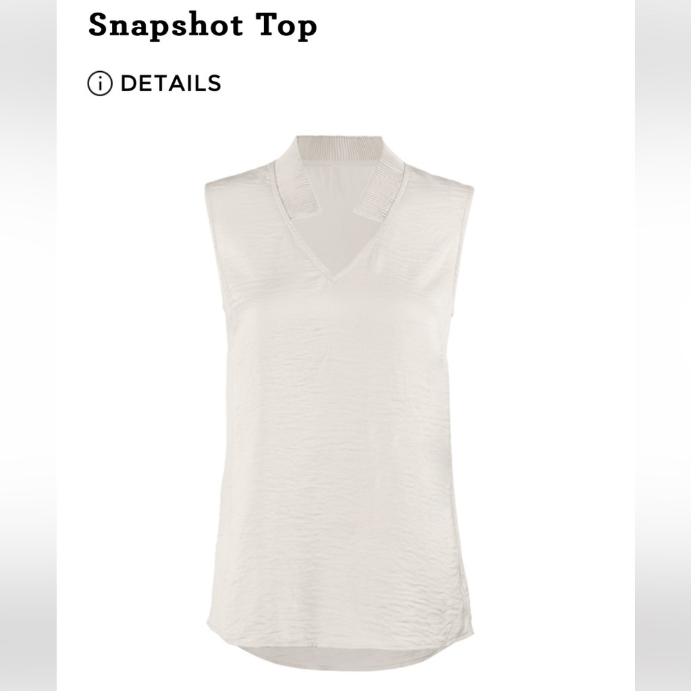 Snapshot Top Cabi Worn a few times.  Runs Large.